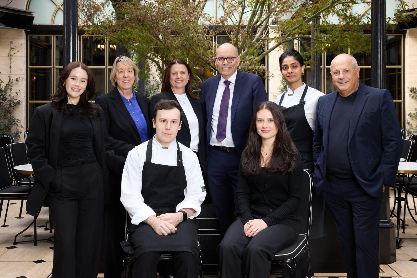 The collective foundation staff members sit for a portrait